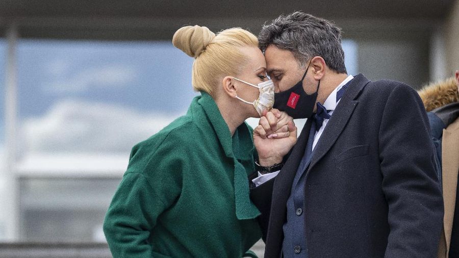 Newlyweds Alla and Modzi kiss through protective face masks after the wedding ceremony with only witnesses, as public gatherings are banned as part of Lithuania's lockdown measures to prevent the spread of coronavirus disease (COVID-19) in Vilnius, Lithuania, Friday, April 3, 2020. All public and private events are banned in Lithuania, clubs, bars restaurants and most shops are closed due to the virus outbreak. The new coronavirus causes mild or moderate symptoms for most people, but for some, especially older adults and people with existing health problems, it can cause more severe illness or death. (AP Photo/Mindaugas Kulbis)