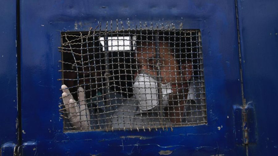 Police arrest doctors demanding facilities and prevention kits to attend coronavirus patients in Quetta, Pakistan, Monday, April 6, 2020. The government imposed a nationwide lockdown to try to contain the outbreak of the virus. (AP Photo/Arshad Butt)