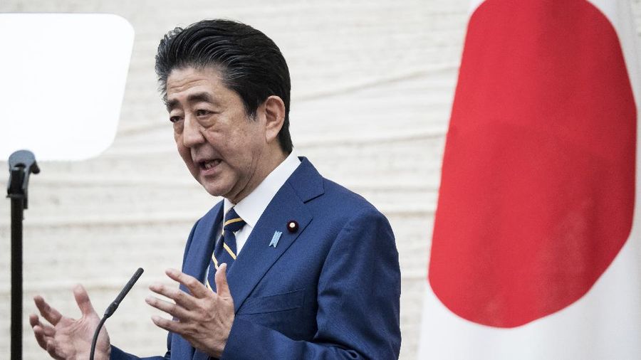 Japan's Prime Minister Shinzo Abe gestures during a press conference at the prime minister's official residence Tuesday, April 7, 2020, in Tokyo. Abe declared a state of emergency for Tokyo and six other prefectures to ramp up defenses against the spread of the coronavirus. (Tomohiro Ohsumi/Pool Photo via AP)