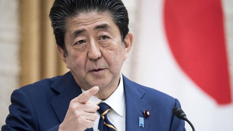 Japan's Prime Minister Shinzo Abe gestures during a press conference at the prime minister's official residence Tuesday, April 7, 2020, in Tokyo. Abe declared a state of emergency for Tokyo and six other prefectures to ramp up defenses against the spread of the coronavirus. (Tomohiro Ohsumi/Pool Photo via AP)