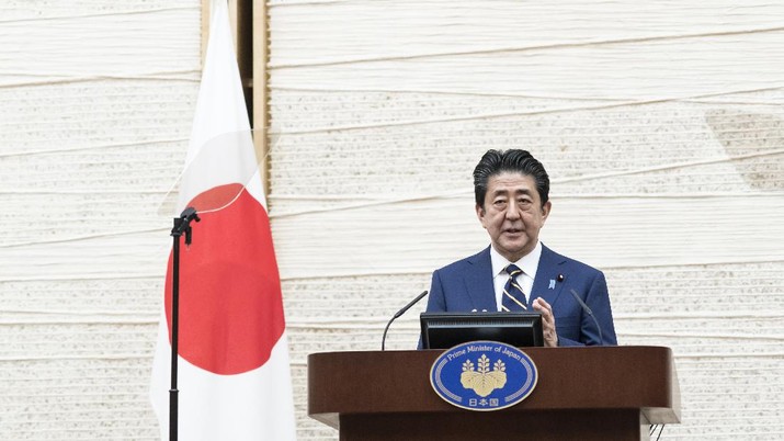 Japan's Prime Minister Shinzo Abe gestures during a press conference at the prime minister's official residence Tuesday, April 7, 2020, in Tokyo. Abe declared a state of emergency for Tokyo and six other prefectures to ramp up defenses against the spread of the coronavirus. (Tomohiro Ohsumi/Pool Photo via AP)