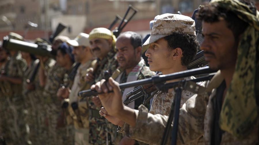 FILE - In this Feb. 20, 2020 file photo, Houthi rebel fighters display their weapons during a gathering aimed at mobilizing more fighters for the Iranian-backed Houthi movement, in Sanaa, Yemen. (AP Photo/Hani Mohammed, File)