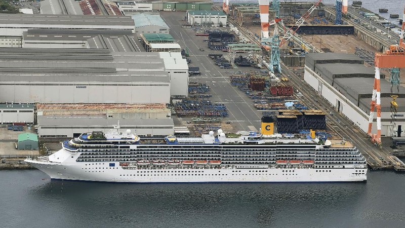 Italian-operated cruise ship the Costa Atlantica is anchored at a port in Nagasaki, southern Japan, Thursday, April 23, 2020. The Costa Atlantica docked since late January is struck by an onboard coronavirus outbreak in which dozens of crew members found to have infected, sending health officials in the southern Japanese city almost free of the virus scrambling to find clues to how the infections started on the ship. (Kyodo News via AP)