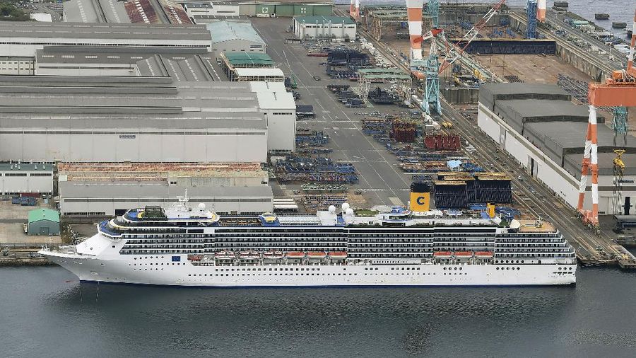 Italian-operated cruise ship the Costa Atlantica is anchored at a port in Nagasaki, southern Japan, Thursday, April 23, 2020. The Costa Atlantica docked since late January is struck by an onboard coronavirus outbreak in which dozens of crew members found to have infected, sending health officials in the southern Japanese city almost free of the virus scrambling to find clues to how the infections started on the ship. (Kyodo News via AP)