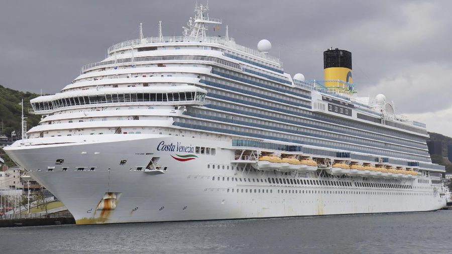 Italian-operated cruise ship the Costa Atlantica is anchored at a port in Nagasaki, southern Japan, Thursday, April 23, 2020. The Costa Atlantica docked since late January is struck by an onboard coronavirus outbreak in which dozens of crew members found to have infected, sending health officials in the southern Japanese city almost free of the virus scrambling to find clues to how the infections started on the ship. (Kyodo News via AP)