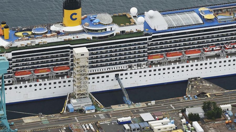 Italian-operated cruise ship the Costa Atlantica is anchored at a port in Nagasaki, southern Japan, Thursday, April 23, 2020. The Costa Atlantica docked since late January is struck by an onboard coronavirus outbreak in which dozens of crew members found to have infected, sending health officials in the southern Japanese city almost free of the virus scrambling to find clues to how the infections started on the ship. (Kyodo News via AP)