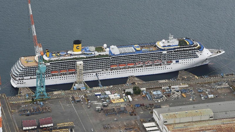 Italian-operated cruise ship the Costa Atlantica is anchored at a port in Nagasaki, southern Japan, Thursday, April 23, 2020. The Costa Atlantica docked since late January is struck by an onboard coronavirus outbreak in which dozens of crew members found to have infected, sending health officials in the southern Japanese city almost free of the virus scrambling to find clues to how the infections started on the ship. (Kyodo News via AP)
