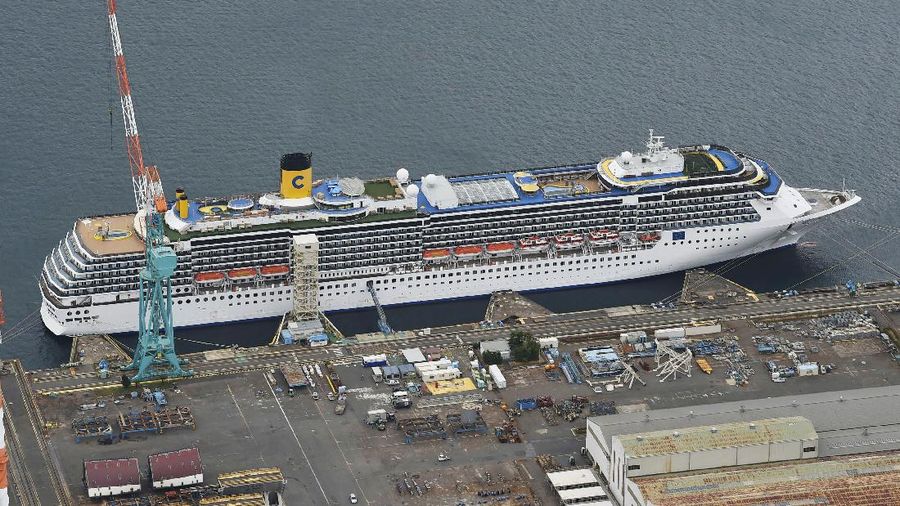 Italian-operated cruise ship the Costa Atlantica is anchored at a port in Nagasaki, southern Japan, Thursday, April 23, 2020. The Costa Atlantica docked since late January is struck by an onboard coronavirus outbreak in which dozens of crew members found to have infected, sending health officials in the southern Japanese city almost free of the virus scrambling to find clues to how the infections started on the ship. (Kyodo News via AP)