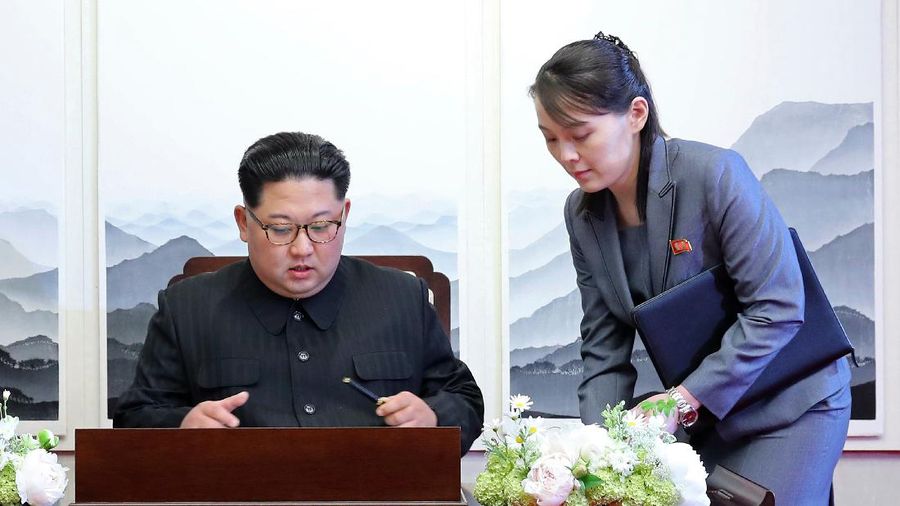 FILE - In this April 27, 2018, file photo, North Korean leader Kim Jong Un signs a guestbook next to his sister Kim Yo Jong, right, inside the Peace House at the border village of Panmunjom in Demilitarized Zone. With North Korea saying nothing so far about outside media reports that leader Kim Jong Un may be unwell, there’s renewed worry about who’s next in line to run a nuclear-armed country that’s been ruled by the same family for seven decades. (Korea Summit Press Pool via AP, File)