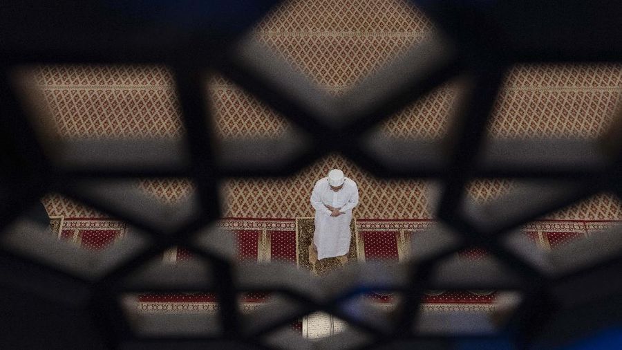A Muslim prays during the first day of the holy month of Ramadan at National Mosque in Kuala Lumpur, Malaysia, on Friday, April 24, 2020. Muslims across the world began marking the holy month of Ramadan under unprecedented coronavirus lockdowns. Ramadan, which begins Friday, faithful Muslims normally fast during the day and then congregate for night prayers and share communal meals. (AP Photo/Vincent Thian)