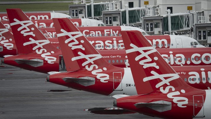 Air Asia planes Airbus A320 parked at tarmac at KLIA2 low cost terminal in Sepang, Malaysia, on Monday, April 27, 2020. AirAsia is on a temporary hibernation to all international and domestic flights due to the ongoing global outbreak of Covid-19. (AP Photo/Vincent Thian)
