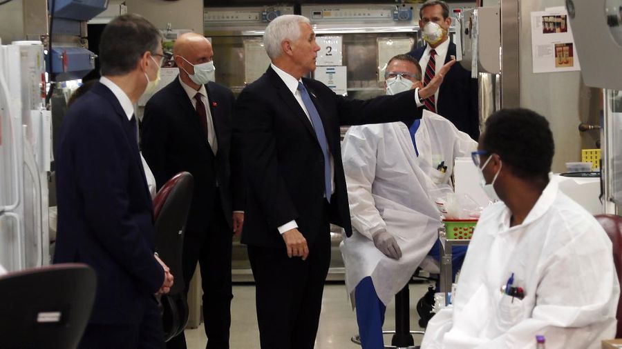 Vice President Mike Pence visits the molecular testing lab at Mayo Clinic Tuesday, April 28, 2020, in Rochester, Minn., where he toured the facilities supporting COVID-19 research and treatment. Pence chose not to wear a face mask while touring the Mayo Clinic in Minnesota. It's an apparent violation of the world-renowned medical center's policy requiring them. (AP Photo/Jim Mone)