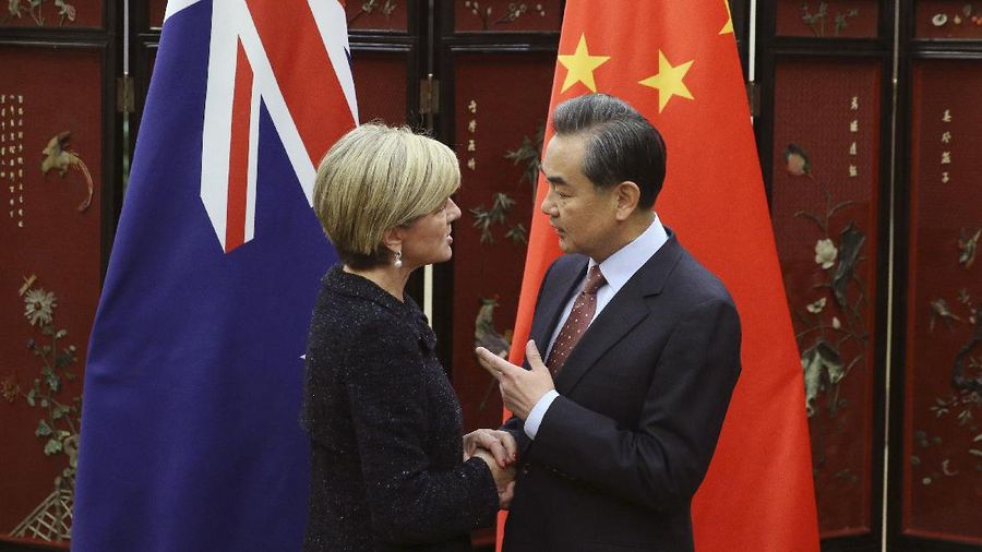 Australian Foreign Minister Julie Bishop, left, shakes hands with Chinese Foreign Minister Wang Yi as she arrives for a meeting at the Ministry of Foreign Affairs in Beijing, Wednesday, Feb. 17, 2016. (Wu Hong/Pool Photo via AP)