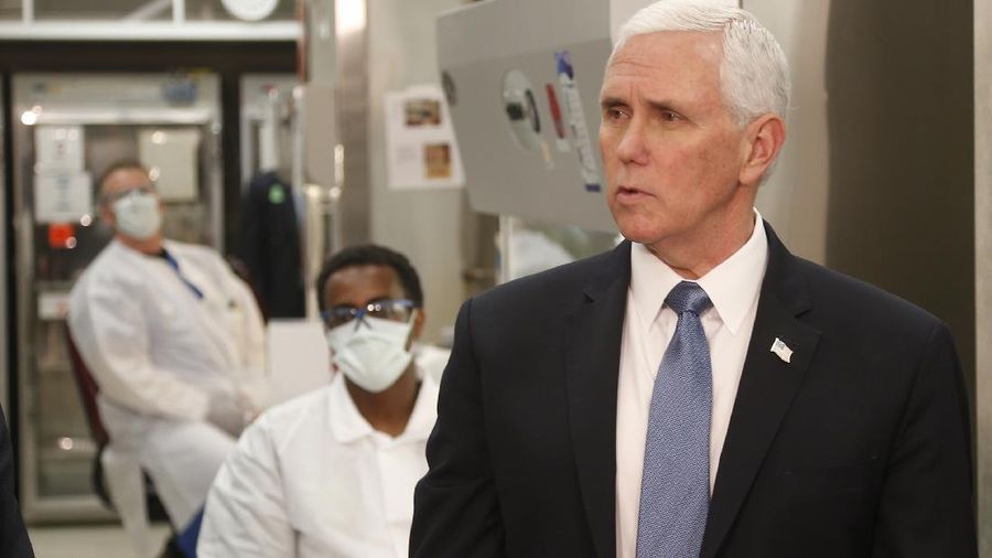 Vice President Mike Pence visits the molecular testing lab at Mayo Clinic Tuesday, April 28, 2020, in Rochester, Minn., where he toured the facilities supporting COVID-19 research and treatment. Pence chose not to wear a face mask while touring the Mayo Clinic in Minnesota. It's an apparent violation of the world-renowned medical center's policy requiring them. (AP Photo/Jim Mone)
