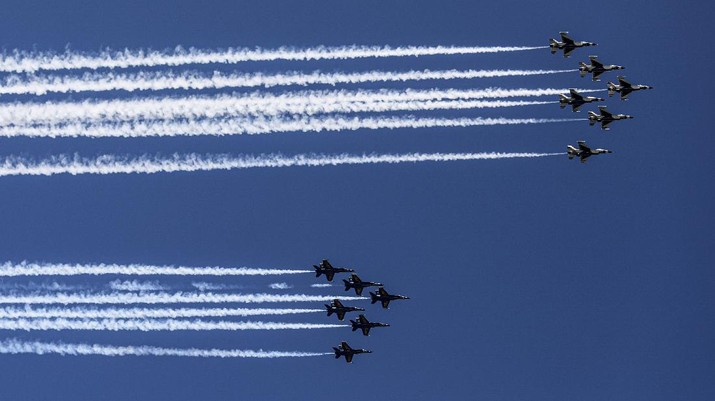 U.S. Navy Blue Angels and U.S. Air Force Thunderbirds flyover New York City skyline, Tuesday April 28, 2020, in New York. The flyover was in salute to first responders in the fight against the COVID-19 pandemic. (AP Photo/Bebeto Matthews)