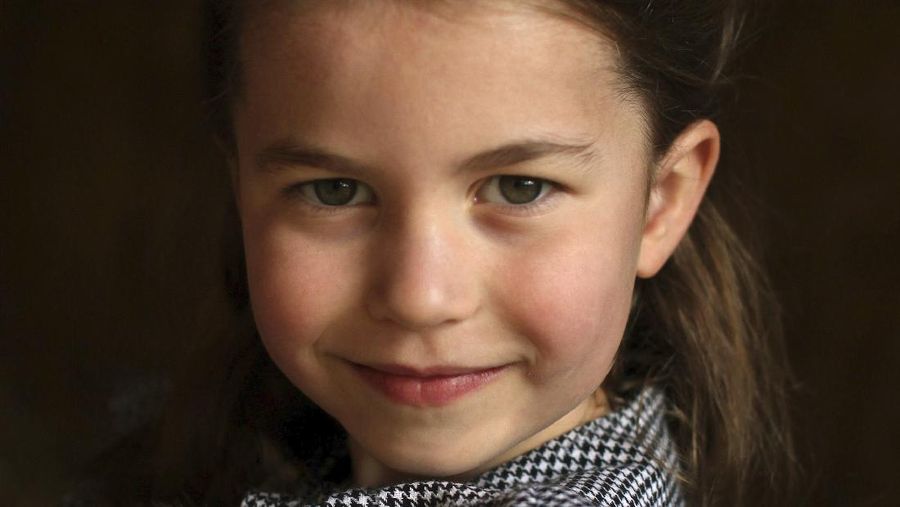 In this undated handout photo released by Kensington Palace, Britain's Princess Charlotte helps to deliver food packages for isolated pensioners in the local area along with her family, on the Sandringham Estate in King's Lynn, England. Princess Charlotte celebrates her fifth birthday on Saturday, May 2, 2020. (Duchess of Cambridge/Kensington Palace via AP)