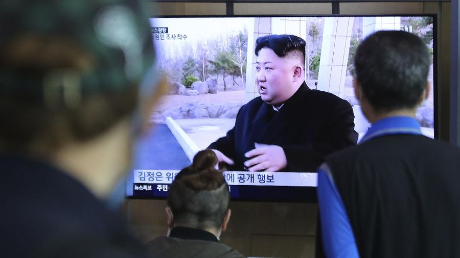 People watch a TV showing a file image of North Korean leader Kim Jong Un during a news program at the Seoul Railway Station in Seoul, South Korea, Saturday, May 2, 2020. Kim made his first public appearance in several weeks as he celebrated the completion of a fertilizer factory near Pyongyang, state media said Saturday, ending an absence that had triggered global rumors that he was seriously ill. (AP Photo/Ahn Young-joon)