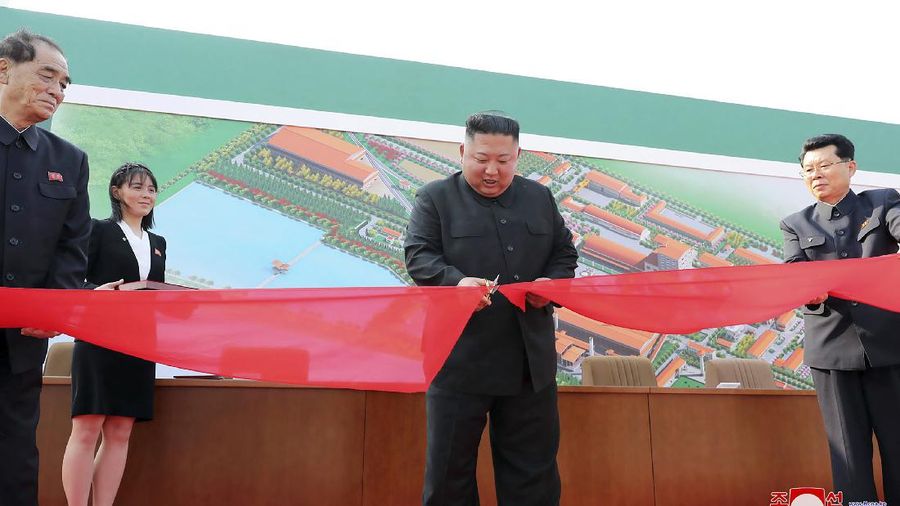 ADDS CITY AND ID OF WOMAN - In this Friday, May 1, 2020, photo provided by the North Korean government, North Korean leader Kim Jong Un, center, cuts a tape, watched by his sister Kim Yo Jong, during his visit to a fertilizer factory in Sunchon, South Pyongan province, near Pyongyang, North Korea. Kim made his first public appearance in 20 days as he celebrated the completion of the fertilizer factory, state media said Saturday, May 2, 2020, ending an absence that had triggered global rumors that he may be seriously ill. Independent journalists were not given access to cover the event depicted in this image distributed by the North Korean government. The content of this image is as provided and cannot be independently verified. Korean language watermark on image as provided by source reads: