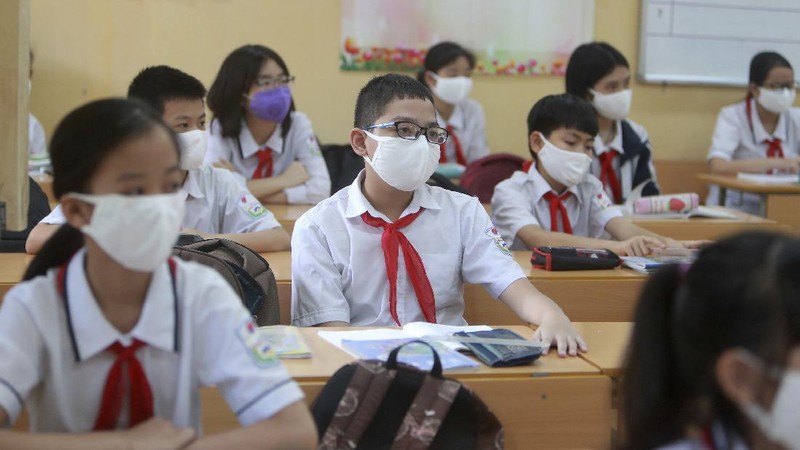 Students wearing masks attend a class in Dinh Cong secondary school in Hanoi, Vietnam Monday, May 4, 2020. Students across Vietnam return to school after three months of studying online due to school closure to contain the spread of COVID-19. (AP Photo/Hau Dinh)