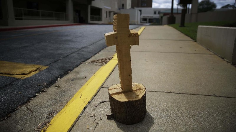 An empty road leading towards a rural countryside of Dawson, Ga., is seen on Friday, April 17, 2020, in Dawson, Ga. Of the 20 counties with the highest death rate in America, six of them are in rural southwest Georgia, where there are no packed skyrise apartment buildings or subways. Other out-of-the way places so far unscathed by the pandemic might believe, like many in Dawson once did, that the virus won't find them out there. But ambulances rushed along country roads, fields and farms in either direction, carrying COVID-19 patients to the nearest hospital, for some an hour away. (AP Photo/Brynn Anderson)
