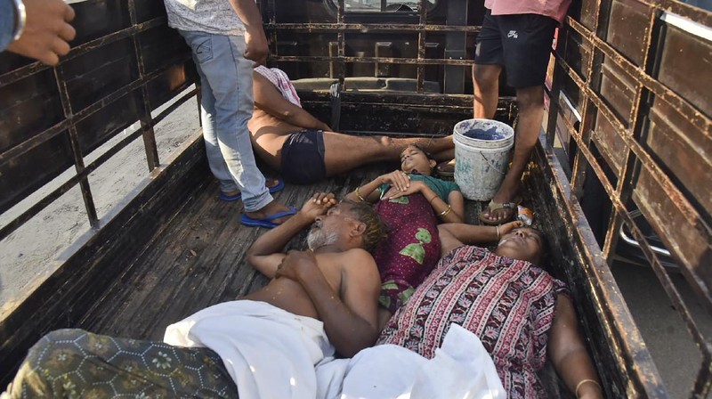 Firefighters walk with oxygen cylinders outside LG Polymers plant, the site of a chemical gas leak, in Vishakhapatnam, India, Thursday, May 7, 2020. Synthetic chemical styrene leaked from the industrial plant in southern India early Thursday, leaving people struggling to breathe and collapsing in the streets as they tried to flee. Administrator Vinay Chand said several people fainted on the road and were rushed to a hospital. (AP Photo)