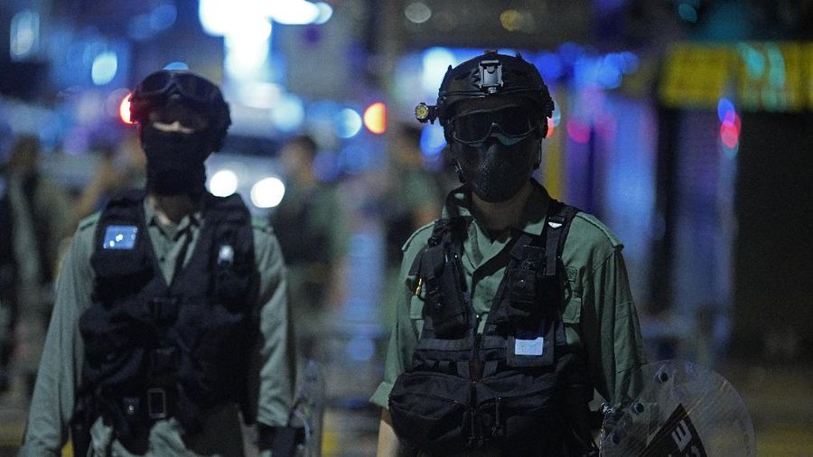 A police officer stand guard as more than 200 people were arrested during anti-government protests in Hong Kong early Monday, May 11, 2020. A pro-democracy movement that paralyzed Hong Kong for months last year has shown signs of reviving in recent weeks as the coronavirus threat eases. The government recently decided to allow public gatherings of eight people, up from four previously. (AP Photo/Vincent Yu)