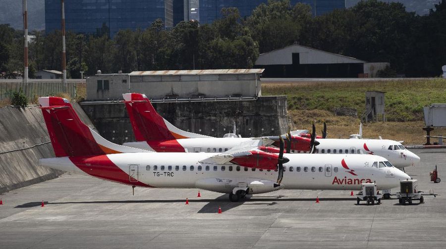 Avianca FILE - In this March 17, 2020 file photo, aircraft from the Avianca airline sit parked at La Aurora airport in Guatemala City. Avianca’s Chief financial officer Adrian Neuhauser said the airline is asking various governments, including Colombia’s, for help in ensuring it has liquidity to operate during its Chapter 11 proceeding, which could last up to 18 months. (AP Photo/Moises Castillo, File)