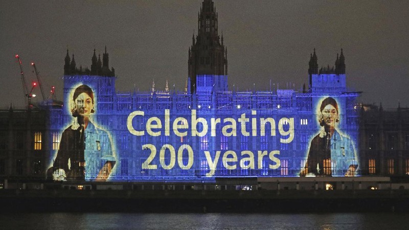 An image of Florence Nightingale is projected on the Houses of Parliament in Westminster, London, on International Nurses Day and to mark the 200th anniversary of the birth of the nurse, Tuesday, May 12, 2020. Historians have praised Florence Nightingale on the 200th anniversary of her birth, and said her legacy has 