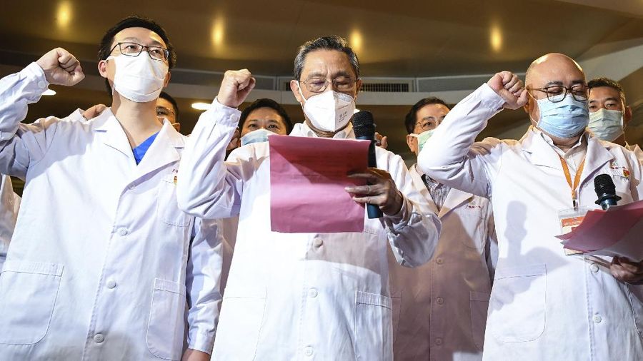 In this March 2, 2020 photo released by Xinhua News Agency, renowned Chinese respiratory specialist Zhong Nanshan attends an oath-taking ceremony via video connections for two new probationary Communist Party members in Wuhan to take the oath of joining the Communist Party of China, in Guangzhou, southern China's Guangdong Province. As the rest of the world grapples with a burgeoning virus outbreak, China's ruling Communist Party has turned to its propaganda playbook to portray its leader as firmly in charge, leading an army of health workers in a 