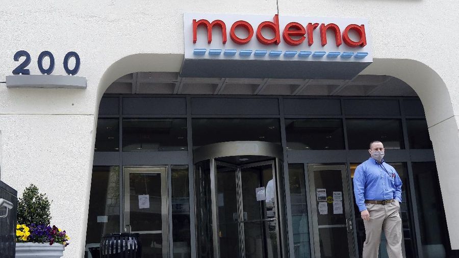 A sign marks an entrance to a Moderna, Inc., building, Monday, May 18, 2020, in Cambridge, Mass. Moderna announced Monday, May 18, 2020, that an experimental vaccine against the coronavirus showed encouraging results in very early testing, triggering hoped-for immune responses in eight healthy, middle-aged volunteers.(AP Photo/Bill Sikes)