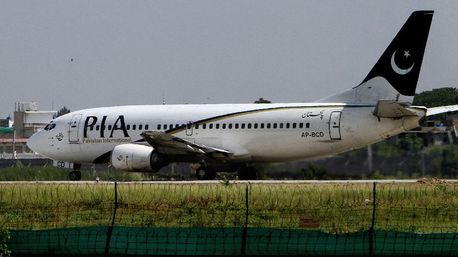 In this Saturday, June 8, 2013 photo, a Pakistani International Airline plane moments before take off from the Benazir Bhutto airport in Islamabad, Pakistan. Most of Pakistan's planes are more than 25 years old and not in the best of shape, its staff is bloated, and every flight is probably costing the state money instead of adding to its bottom line, with the carrier losing some $300 million a year. Thats emblematic of the problems with Pakistans state-owned enterprises, underlining how difficult it will be for Prime Minister Nawaz Sharif to carry out a key promise for rebuilding the economy, rescuing, reforming and possibly privatizing a slew of state companies. (AP Photo/Anjum Naveed)