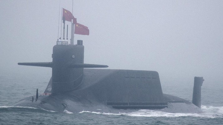 A new type 094A Jin-class nuclear submarine Long March 10 of the Chinese People's Liberation Army (PLA) Navy participates in a naval parade to commemorate the 70th anniversary of the founding of China's PLA Navy in the sea near Qingdao in eastern China's Shandong province, Tuesday, April 23, 2019. (AP Photo/Mark Schiefelbein, Pool)