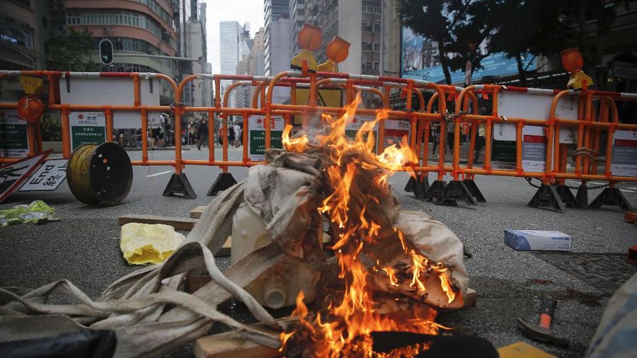 Riot Police use pepper spray to protesters during a protest against Beijing's national security legislation in Causeway Bay in Hong Kong, Sunday, May 24, 2020. Hong Kong police fired volleys of tear gas in a popular shopping district as hundreds took to the streets Sunday to march against China's proposed tough national security legislation for the city. (AP Photo/Kin Cheung)