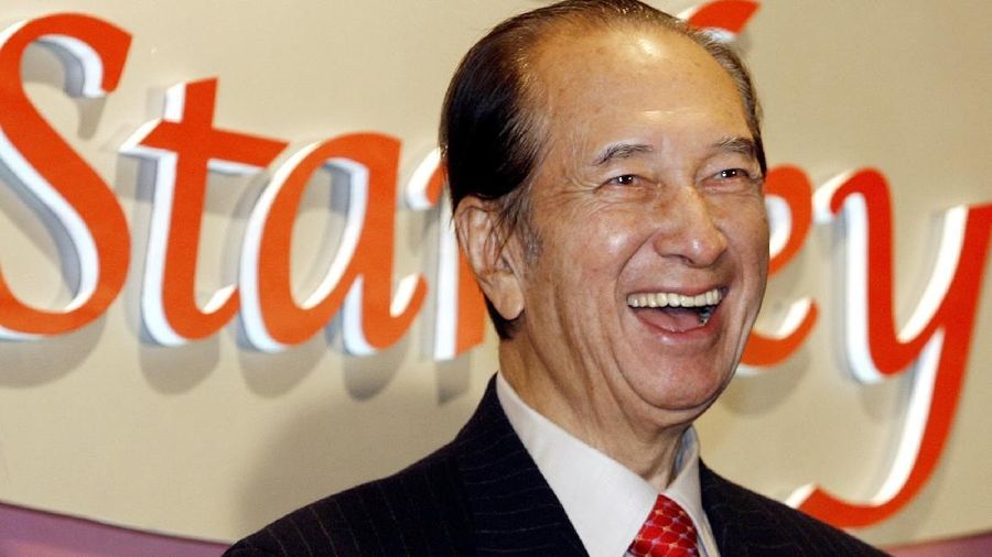 FILE - In this Nov. 20, 2006, file photo, Macao tycoon Stanley Ho smiles during a party to celebrate his 85th birthday in Hong Kong. On Tuesday, May 26, 2020, the family of Stanley Ho, the Macao casino tycoon considered the father of modern gambling in China, has died at 98. (AP Photo/Vincent Yu, File)
