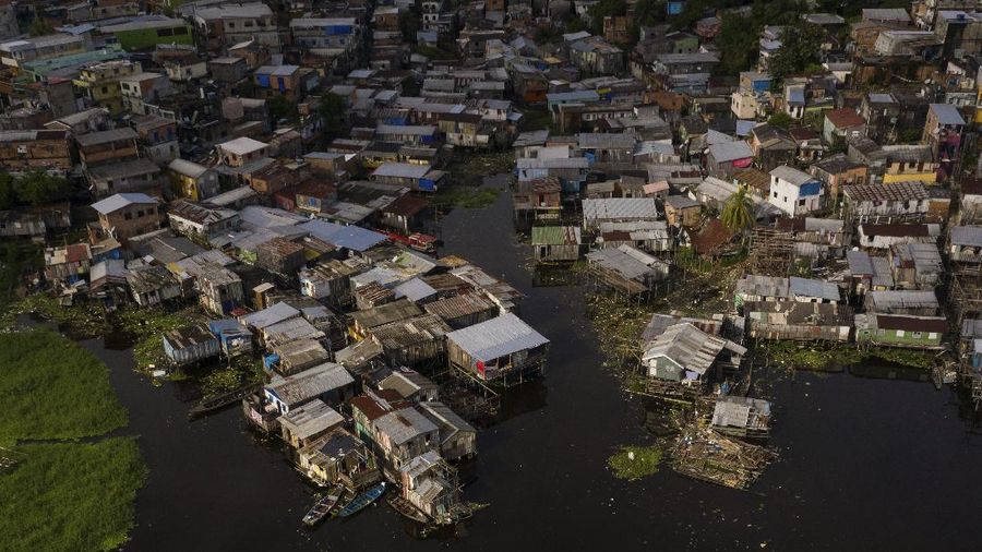 The riverside Educandos neighborhood is seen from above in Manaus, Brazil, Saturday, May 16, 2020. Per capita, Manaus is Brazil's major city hardest hit by COVID-19. (AP Photo/Felipe Dana)