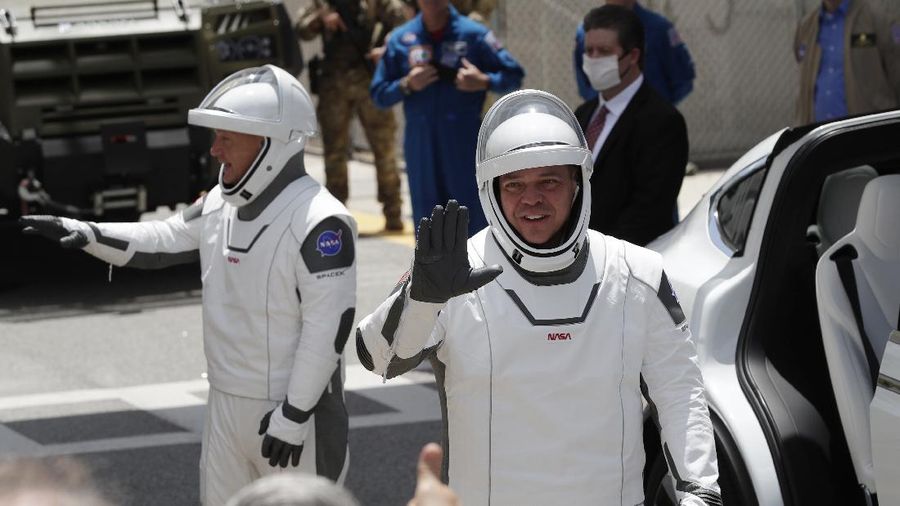 A SpaceX Falcon 9, with NASA astronauts Doug Hurley and Bob Behnken in the Crew Dragon capsule, lifts off from Pad 39-A at the Kennedy Space Center in Cape Canaveral, Fla., Saturday, May 30, 2020. The two astronauts are on the SpaceX test flight to the International Space Station. For the first time in nearly a decade, astronauts blasted towards orbit aboard an American rocket from American soil, a first for a private company. (AP Photo/David J. Phillip)