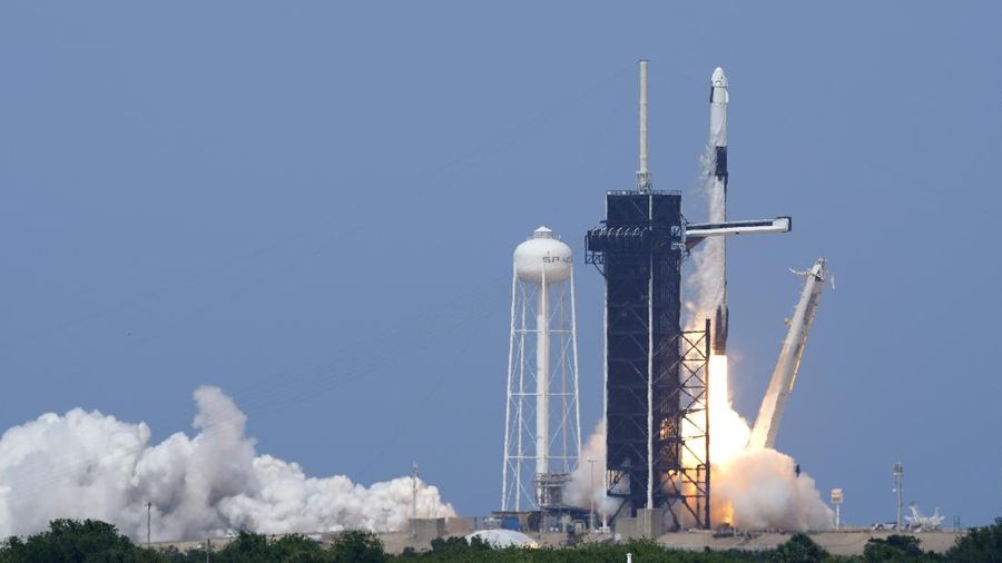 A SpaceX Falcon 9, with NASA astronauts Doug Hurley and Bob Behnken in the Crew Dragon capsule, lifts off from Pad 39-A at the Kennedy Space Center in Cape Canaveral, Fla., Saturday, May 30, 2020. The two astronauts are on the SpaceX test flight to the International Space Station. For the first time in nearly a decade, astronauts blasted towards orbit aboard an American rocket from American soil, a first for a private company. (AP Photo/David J. Phillip)