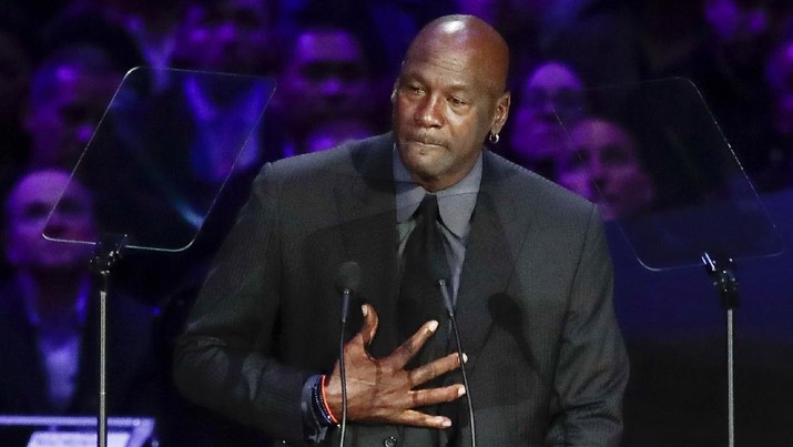 FILE - In this Feb. 24, 2020, file photo, former NBA player Michael Jordan reacts while speaking during a celebration of life for Kobe Bryant and his daughter Gianna in Los Angeles. Jordan is 