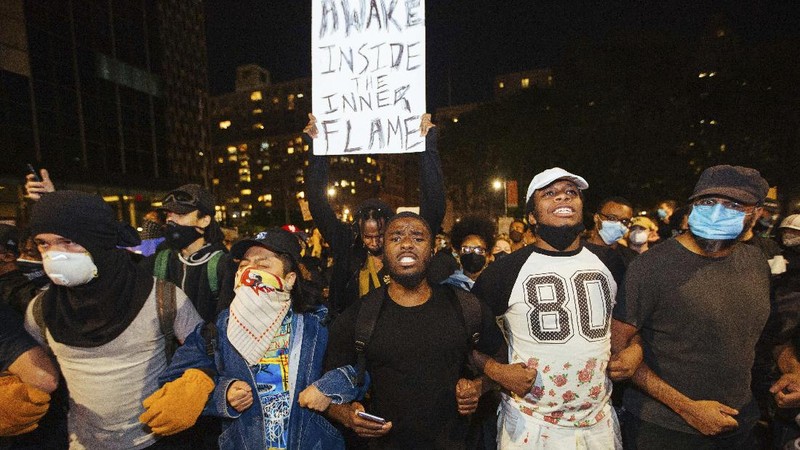 Police officers arrest a protester Sunday, May 31, 2020, in Los Angeles, during a demonstration over the death of George Floyd, who died May 25 after he was pinned at the neck by a Minneapolis police officer. (AP Photo/Ringo H.W. Chiu)