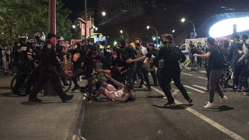 Police officers arrest a protester Sunday, May 31, 2020, in Los Angeles, during a demonstration over the death of George Floyd, who died May 25 after he was pinned at the neck by a Minneapolis police officer. (AP Photo/Ringo H.W. Chiu)