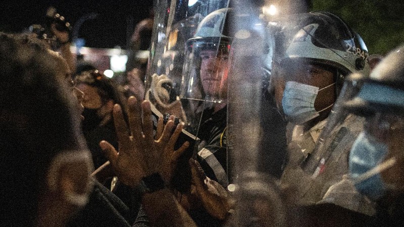 Police officers arrest a protester Sunday, May 31, 2020, in Los Angeles, during a demonstration over the death of George Floyd, who died May 25 after he was pinned at the neck by a Minneapolis police officer. (AP Photo/Ringo H.W. Chiu)