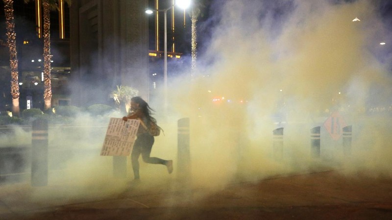 Police officers arrest a protester Sunday, May 31, 2020, in Los Angeles, during a demonstration over the death of George Floyd, who died May 25 after he was pinned at the neck by a Minneapolis police officer. (AP Photo/Ringo H.W. Chiu)