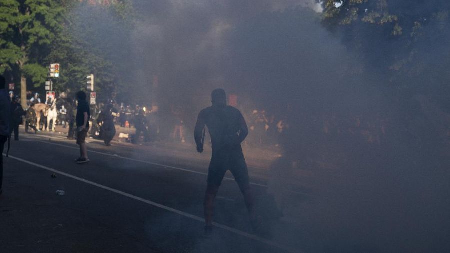 Demonstrators gather to protest the death of George Floyd, Monday, June 1, 2020, near the White House in Washington. Floyd died after being restrained by Minneapolis police officers. (AP Photo/Evan Vucci)
