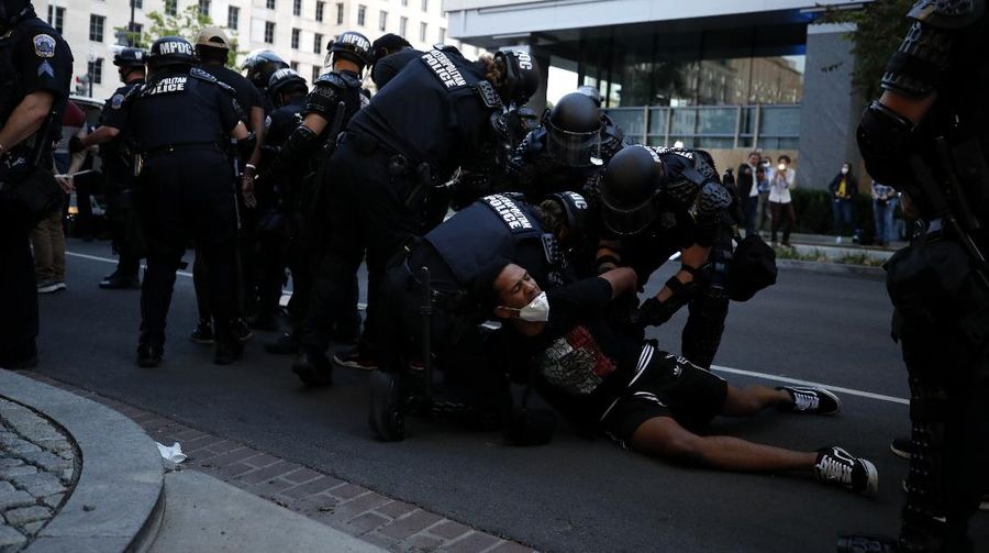 Demonstrators gather to protest the death of George Floyd, Monday, June 1, 2020, near the White House in Washington. Floyd died after being restrained by Minneapolis police officers. (AP Photo/Evan Vucci)