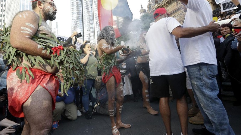 Protestors march in Sydney, Saturday, June 6, 2020, to support the cause of U.S. protests over the death of George Floyd. Black Lives Matter protests across Australia proceeded mostly peacefully as thousands of demonstrators in state capitals honored the memory of Floyd and protested the deaths of indigenous Australians in custody. (AP Photo/Rick Rycroft)