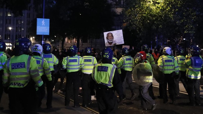 People take part in a Black Lives Matter protest rally in Manchester, England, Sunday, June 7, 2020, in response to the recent killing of George Floyd by police officers in Minneapolis, USA, that has led to protests in many countries and across the US. (Danny Lawson/PA via AP)