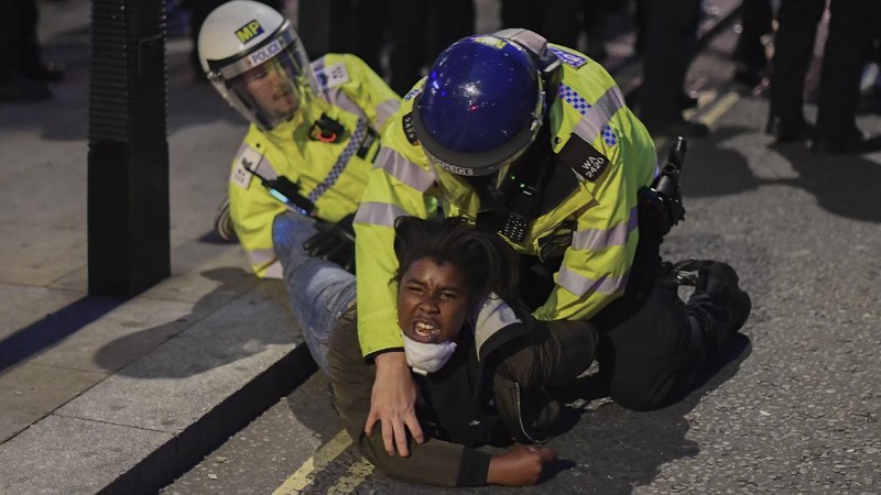 People take part in a Black Lives Matter protest rally in Manchester, England, Sunday, June 7, 2020, in response to the recent killing of George Floyd by police officers in Minneapolis, USA, that has led to protests in many countries and across the US. (Danny Lawson/PA via AP)