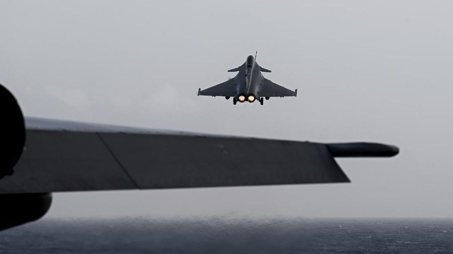 A Rafale fighter jet lands on deck of the French aircraft carrier Charles de Gaulle, off the coast of the city of Hyeyres, southern France, Thursday, Jan. 23, 2020. France deploys the Charles de Gaulle aircraft carrier for a three-month mission to support International military operations in the Middle East, French President Emmanuel Macron said. (Philippe Lopez/Pool Photo via AP)
