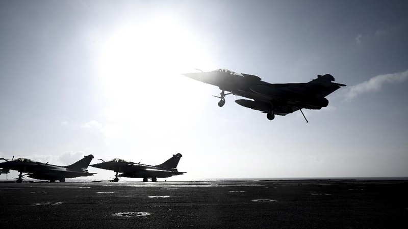 A Rafale fighter jet lands on deck of the French aircraft carrier Charles de Gaulle, off the coast of the city of Hyeyres, southern France, Thursday, Jan. 23, 2020. France deploys the Charles de Gaulle aircraft carrier for a three-month mission to support International military operations in the Middle East, French President Emmanuel Macron said. (Philippe Lopez/Pool Photo via AP)