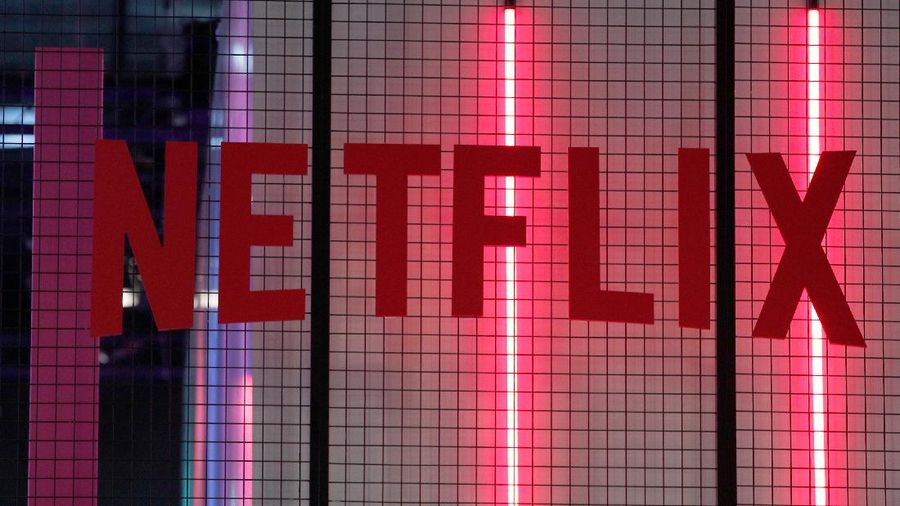 FILE- In this Nov. 4, 2017, file photo, the logo of American entertainment company Netflix is pictured at the Paris games week in Paris. Netflix, Inc. reports earnings Monday, April 16, 2018. (AP Photo/Christophe Ena, File)